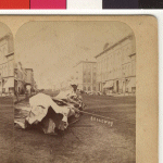 View of South Broadway showing the destruction caused by the 1883 tornado. The object in the foreground is a roll of tin that was torn off the Heaney Building by the 1883 tornado. The Heaney Block is on the right, with the Cook House across the street (to the left of Heaney Block). On the 3rd floor of Heaney Hall, Dr. William Worrall Mayo set up a temporary hospital for the care of those injured in the tornado.