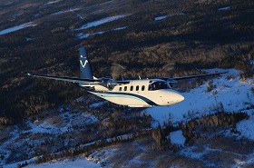 National Oceanic Atmospheric Association Plane Flying Over Snow