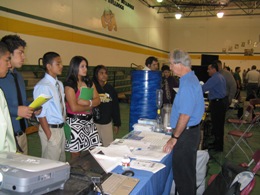 Forecaster Buddy Martin explaining the jobs performed at the NWS office in Brownsville to senior high school students in Lyford, TX, May 2009 (Click for larger image)