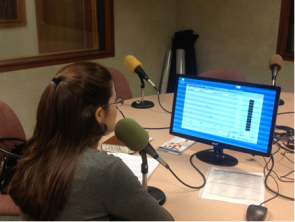 NWS Brownsville/Rio Grande Valley Forecaster Maria Torres monitors incoming calls and social media posts during radio broadcast