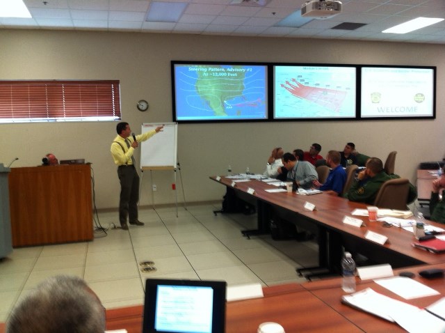 WCM Barry Goldsmith briefs federal and state partners on Hurricane Duff, the exercise scenario for evacuation planning of unaccompanied children