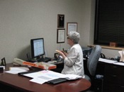 Meteorologist in Charge Nezette Rydell briefing local emergency managers by phone (click to enlarge)