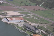 Shingle damage to multi unit building, Port Mansfield (in foreground, click to enlarge)