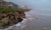 Waves up to and into dune line during peak of coastal flooding, Alex 2010 (click to enlarge)