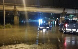 Predawn flooding in west Brownsville along Mexico Boulevard, with water rescue of person trapped in vehicle, May 24, 2015