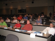 [ Group listens during the Atlanta IWT Workshop. ]