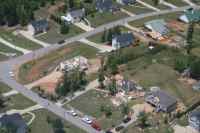 [ Aerial view of damage to homes in a subdivision. ]