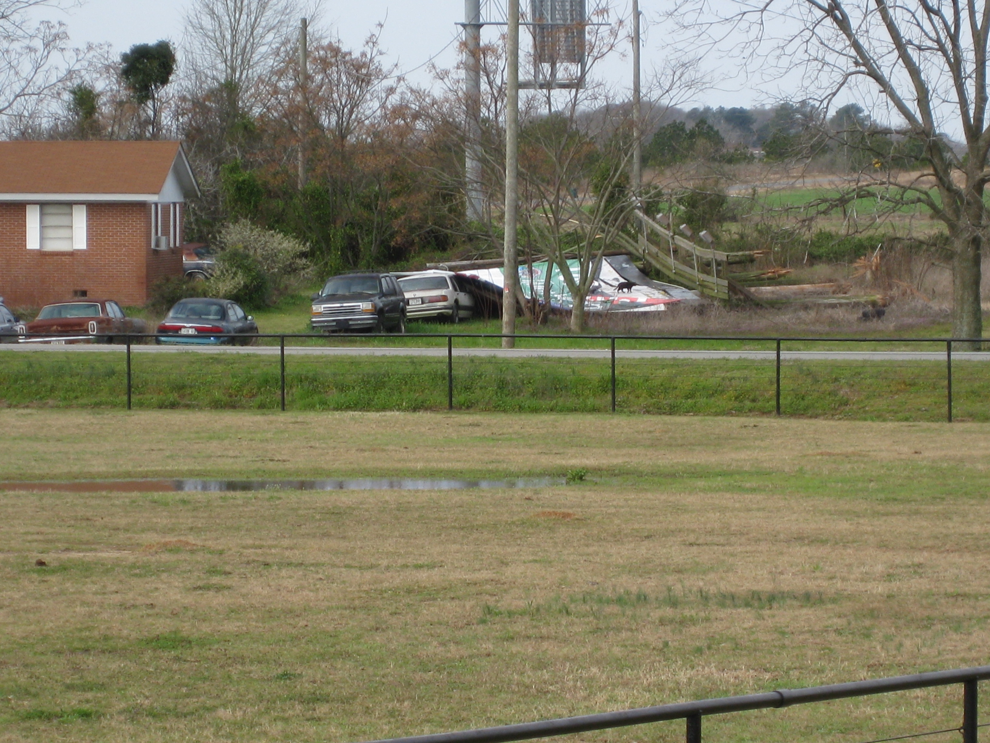 [ Large wooden billboard fell on a car near I-75. ]