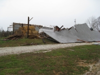 [ Multiple walls of a barn collapsed. ]