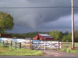 [ funnel cloud in a rural setting ]