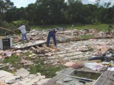 [ Remnants of a shed and small home in Spalding County.  Two injuries occurred here. ]