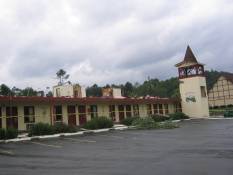 [ Severely damaged hotel in Helen (White County).  Notice the bathrooms are the only rooms remaining on the second story.  An important tornado safety lesson demonstrated!! ]