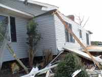 [ another view of house pushed off foundation ]