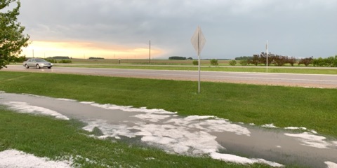 Hail collects in a rain-filled ditch in Spencer, IA. Photo courtesy of Alissa Gray.