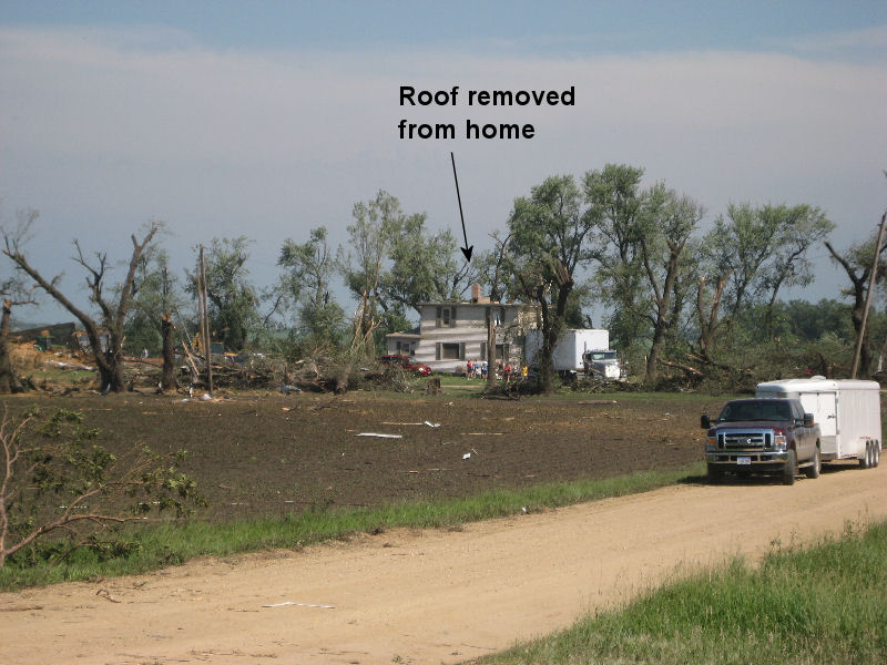 Significant damage to house and shelter belt trees.