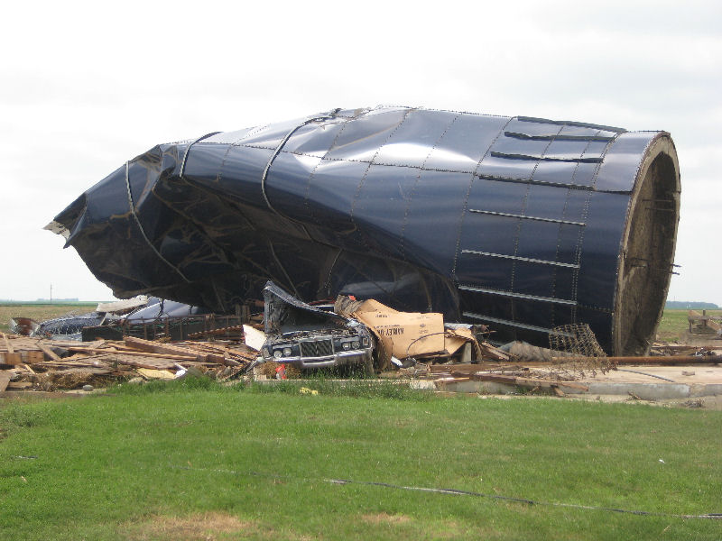 Picture of a silo toppled and crushed by the tornado.