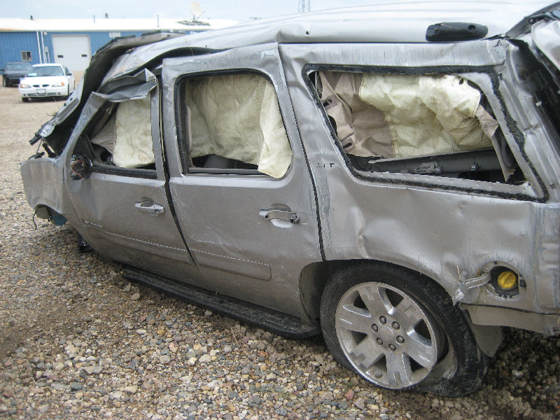 Van damaged by tornado at an overpass near Sibley.