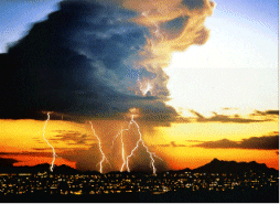 Large thunder storm over city at sunset