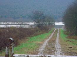 Flood waters flow across a barricaded Rock Cut Road, off U.S. Highway 72 in western Jackson County.