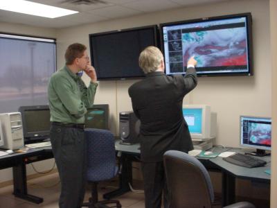 Image of Rep. Cramer looking at first forecast 2