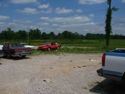 Shortly after touching down, the tornado passed near this equipment company. Surveillance equipment captured dramatic footage of the tornado tossing cars around this parking lot.