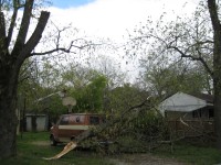 Near the end of the tornado path, utility crews were still working to restore power to houses north of Holmes Avenue.