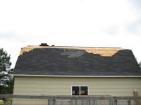 The roof of this barn was damaged by the tornado.