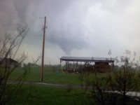 Two trees fell on this mobile home on the southeast side of Grant near the beginning of the tornado's path.