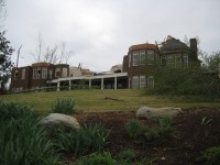 This well-built home lost its roof, and two stone walls were blown over. Walls that were supported by brick remained standing at the home.