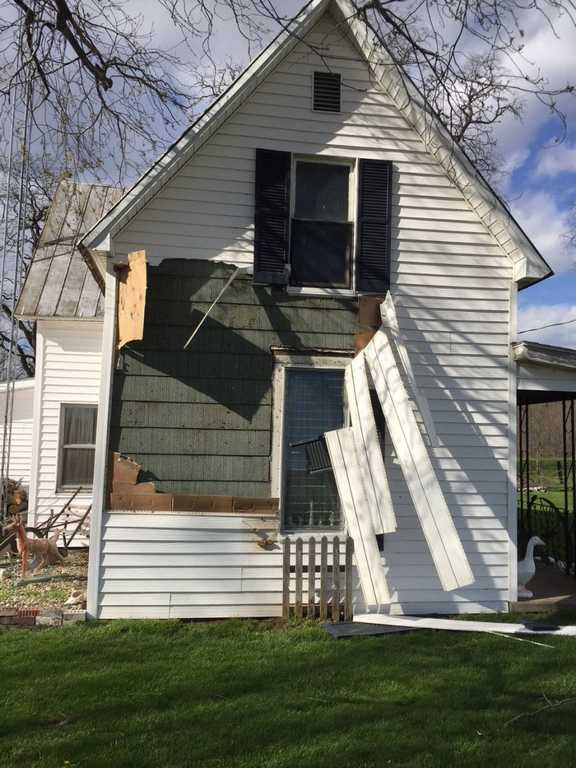 Siding damage southeast of Paris.  Photo by Everett Lau