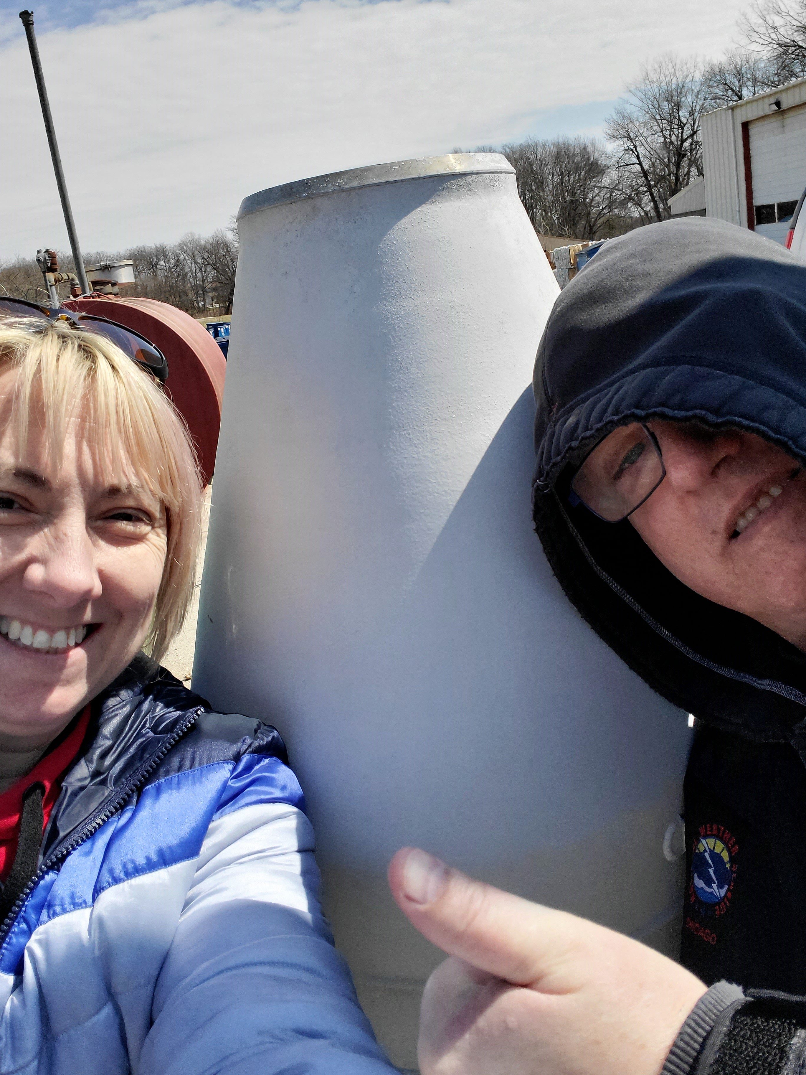 Amy visiting a Cooperative Observer site with a coworker