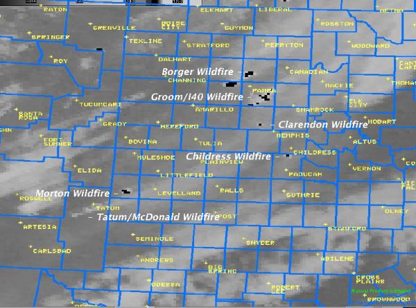 The Infrared image taken around the same time clearly shows several "hot spots", where the intense heat from the wildfires shows up in black on the image