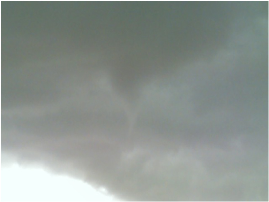 A photo of the visible condensation funnel associated with the tornado that touched down near the intersection of Quaker Avenue and U.S. Highway 84. Photo courtesy Steve Smith via KCBD-TV. 