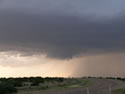 Sequence of images of a severe thunderstorm that tracked across northern Briscoe and Hall Counties on 8 June 2008. The images was taken from Highway 86, about 5 miles northwest of Quiteque, looking north. The pictures were taken, from left to right, around 8:22 pm, 8:23 pm, 8:26 pm, and 8:53 pm, respectively. Click on the images for larger views. Pictures courtesy of David Purkiss. 