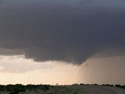 Sequence of images of a severe thunderstorm that tracked across northern Briscoe and Hall Counties on 8 June 2008. The images was taken from Highway 86, about 5 miles northwest of Quiteque, looking north. The pictures were taken, from left to right, around 8:22 pm, 8:23 pm, 8:26 pm, and 8:53 pm, respectively. Click on the images for larger views. Pictures courtesy of David Purkiss. 