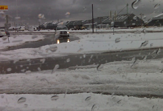 A view of the piles of hail at an intersection in Tulia