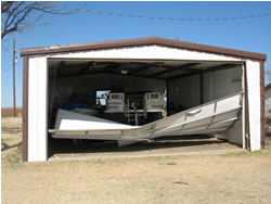 A carport door is blown in by tornado in northwestern Lubbock County. 