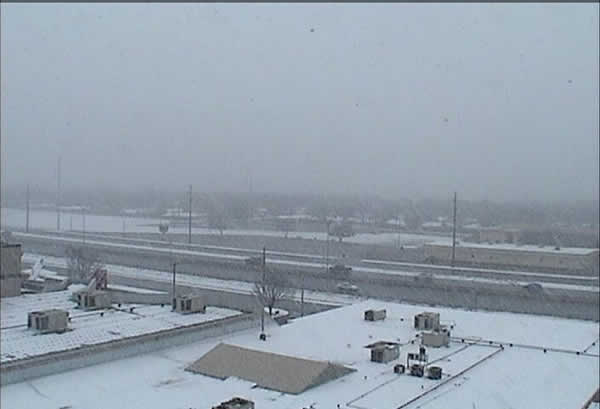 Very large snowflakes falling at the Science Spectrum (southern Lubbock) during the early afternoon of February 11, 2010. Click on the image for a larger view.