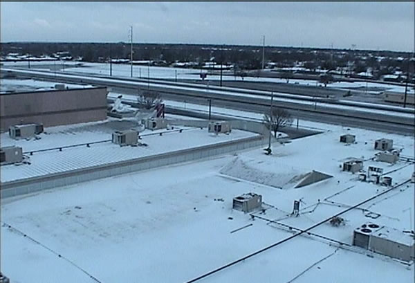 Picture of snow blanketing southwest Lubbock during the early morning hours of Saturday, March 20th. Click on the photo for a larger view.