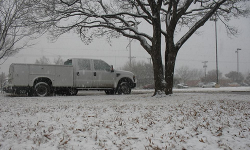 Photograph of snow falling at the Science Spectrum on the afternoon of Monday the 9th