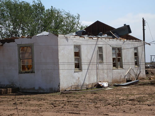 Collapsed Roof from winds estimated to be 80 to 85 mph. Photo taken approximately 1/2 north of FM 41 along FM 179. Click on the picture for a bigger view.