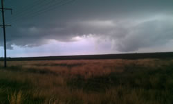 A couple of different views of a wall cloud produced by a storm in east-central Hale County just after 7 pm on 12 October 2012. The left image is courtesy of Gary Skwira and the right image is from Patrick Doll. Click on the pictures for a larger view.