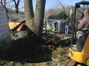 A vehicle was flipped and trees were snapped near Higginson (White County).