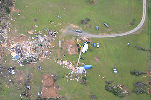 The monster tornado was gone, but the parent storm spawned a new tornado (rated EF2) near Center Hill (White County) that rolled this mobile home.