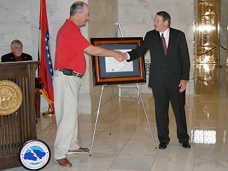  Steven Cooper (front right)...Deputy Director of the National Weather Service (NWS) Southern Region Headquarters in Fort Worth, TX...presented the Thomas Jefferson and Benjamin Franklin Awards to Montgomery County Judge Alvin Black (front left).