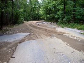 The force of water stripped the pavement from this road.