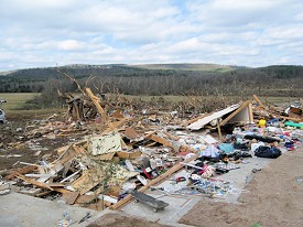 A new home was ripped from the foundation and thrown into a field just northeast of town on Highway 16.