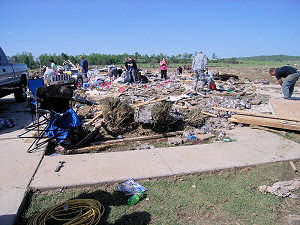 At a nearby subdivision, people were picking up the pieces.