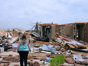 This woman was trying to make sense of all of the damage in the same subdivistion