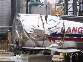 Ciba tanker outer skin deformed. Inner tank unaffected.